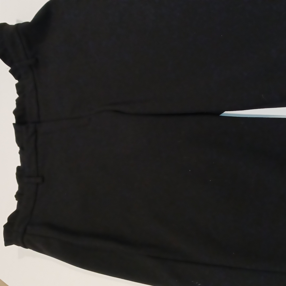 Linda Matthew's black high-waisted ruffled paperbag waist straight leg pants